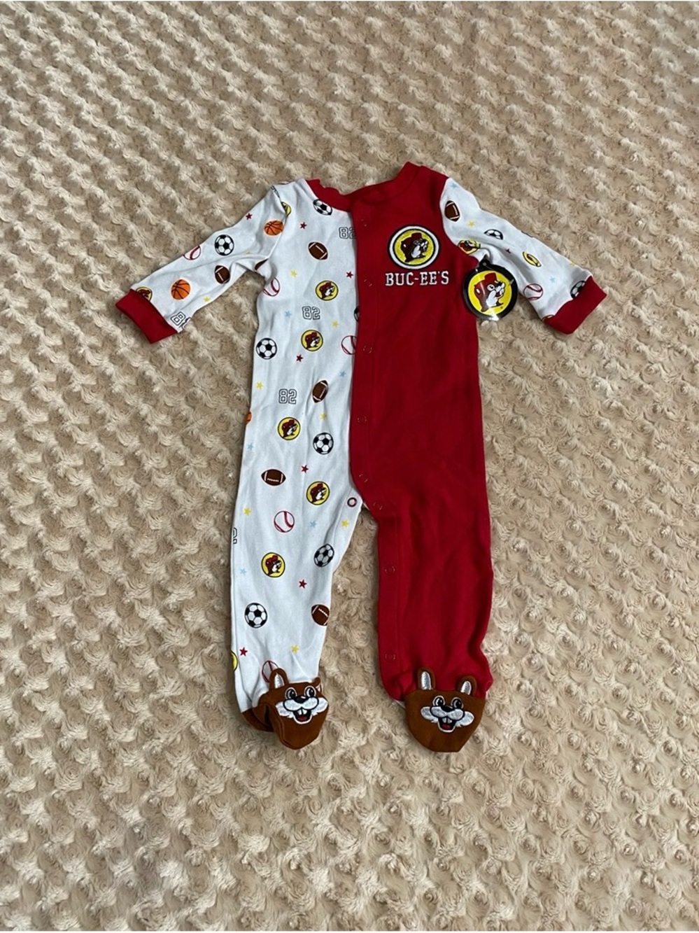 New Buc-ee's Boy 6M Sports Sleeper featuring a red half, a white sports-print
